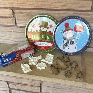 Two tin holiday trays and two sets of cookie cutters